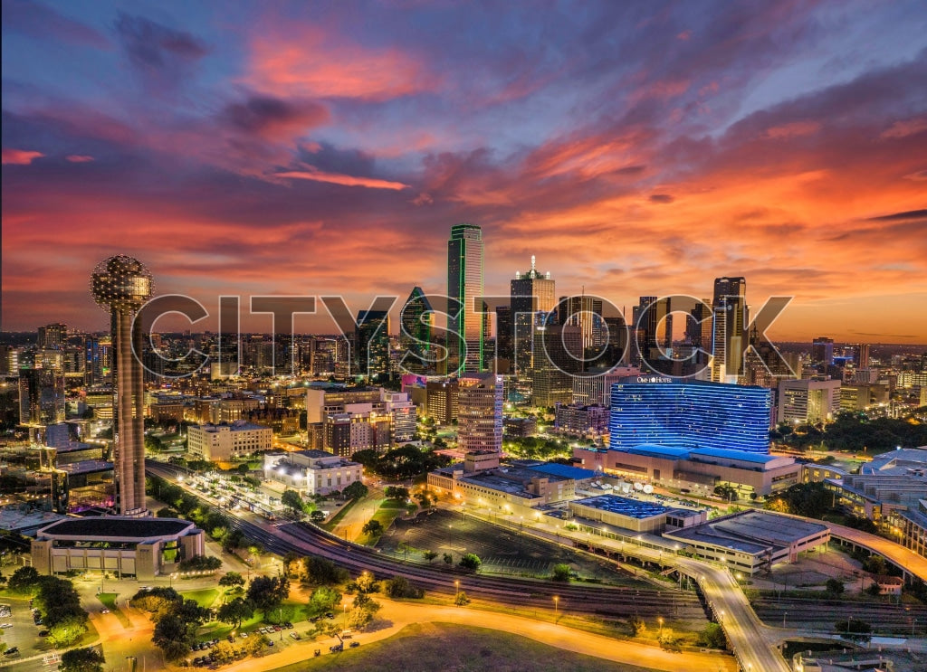 Aerial view of Dallas skyline at sunset with vibrant colors