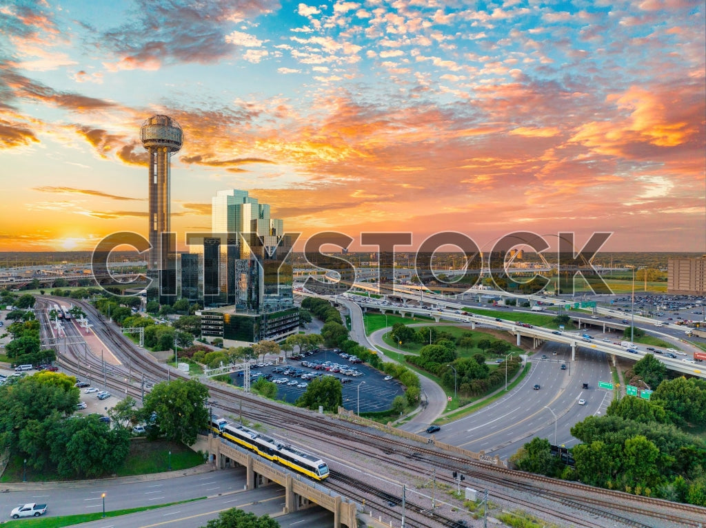 Sunset view of Dallas skyline with Reunion Tower and busy highways