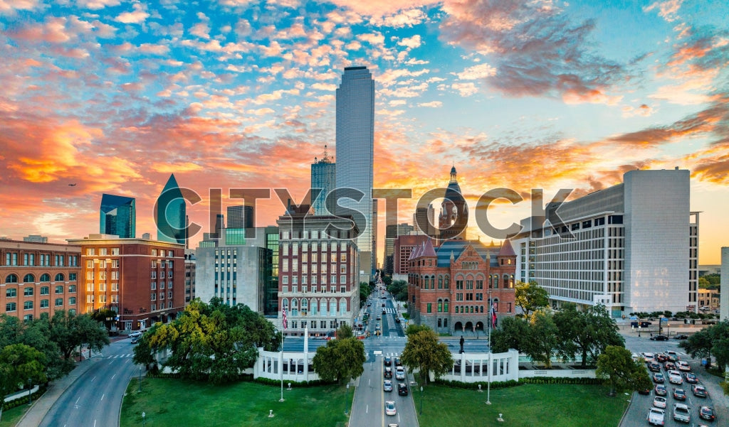 Aerial view of Dallas skyline at sunrise with colorful clouds