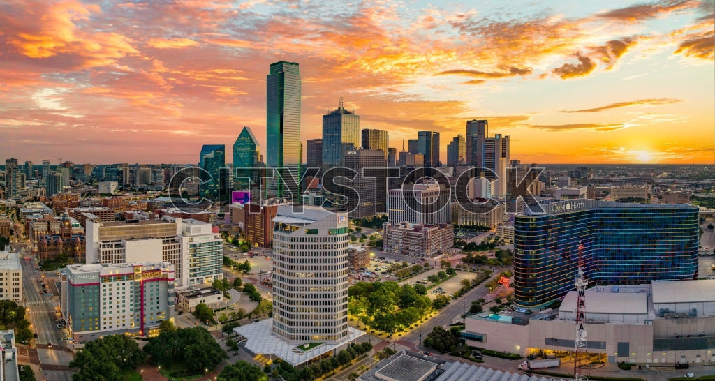 Aerial view of Dallas skyline at sunset with colorful skies