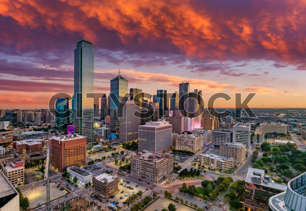 Aerial view of Dallas skyline at sunrise with vibrant colors
