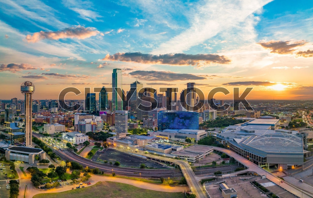 Dallas cityscape at sunset with iconic buildings and roads