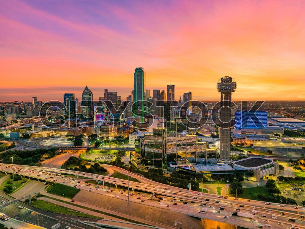 Aerial view of Dallas skyline at sunset with vibrant sky