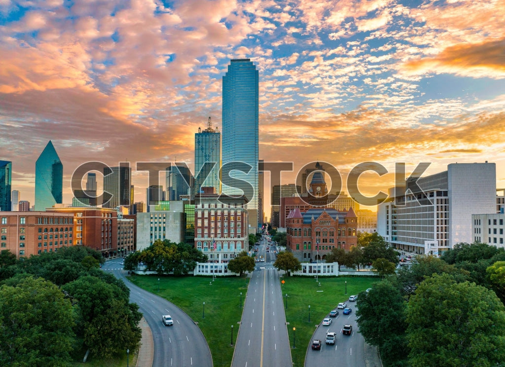 Aerial view of Dallas at sunrise showing vibrant sky and city architecture