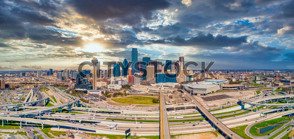 Aerial view of Dallas skyline and highways at sunset