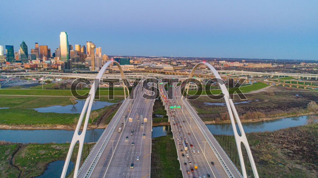 Aerial sunset view of Dallas skyline with city bridges