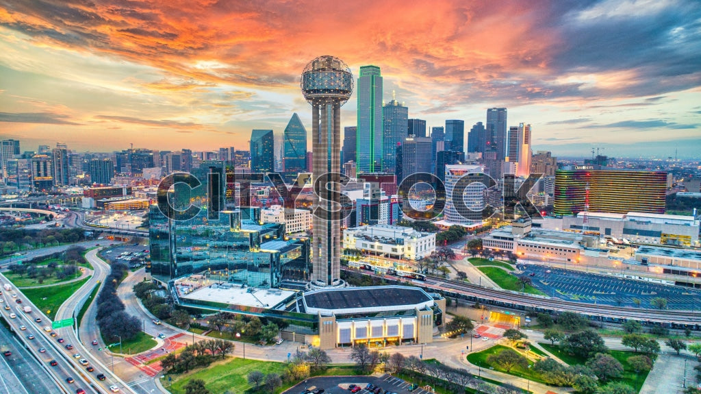 Aerial view of Dallas, Texas skyline at sunrise with vibrant colors