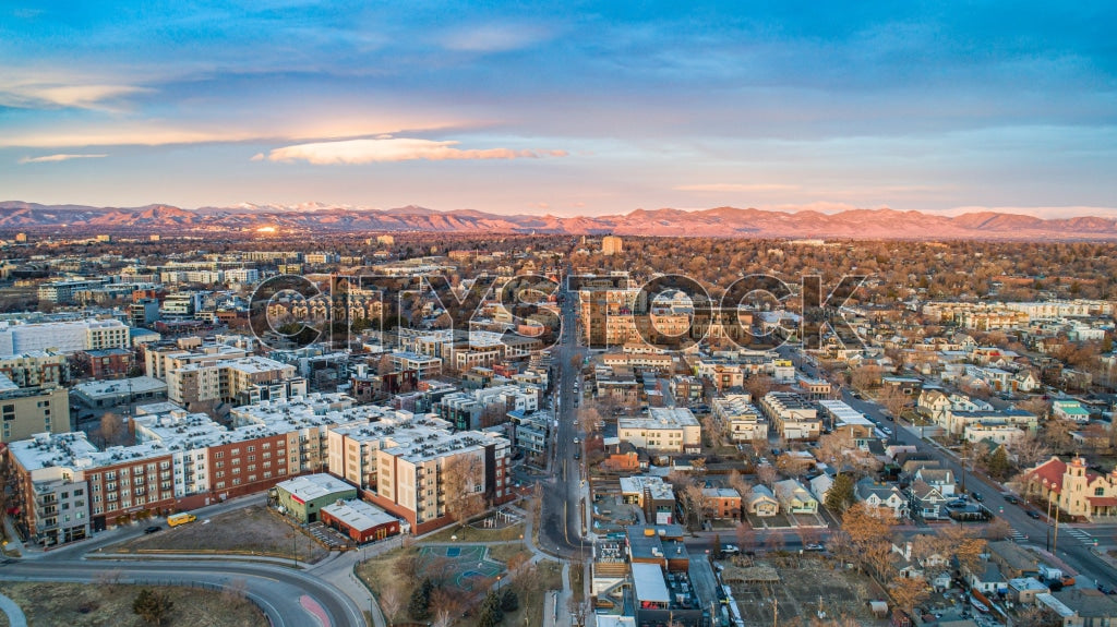 Aerial View of Denver Skyline at Sunset with Rocky Mountains