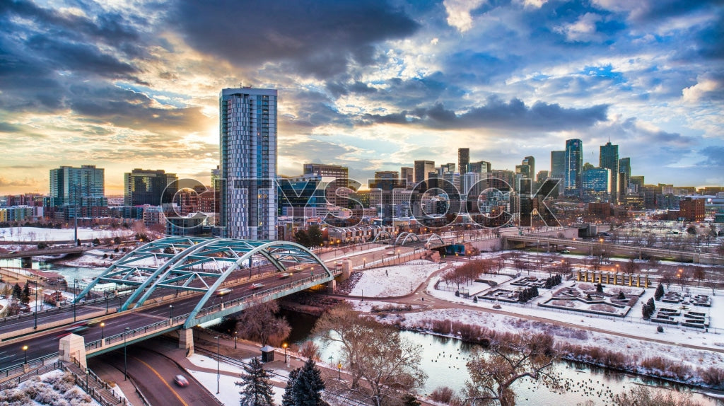 Aerial view of Denver cityscape covered in snow at sunrise