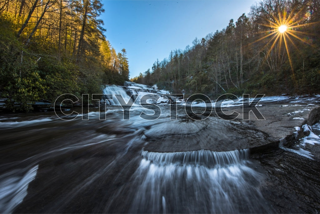 Sunset over a cascading waterfall in Dupont State Forest, NC