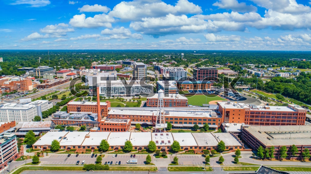 Aerial cityscape of downtown Durham, North Carolina on a sunny day