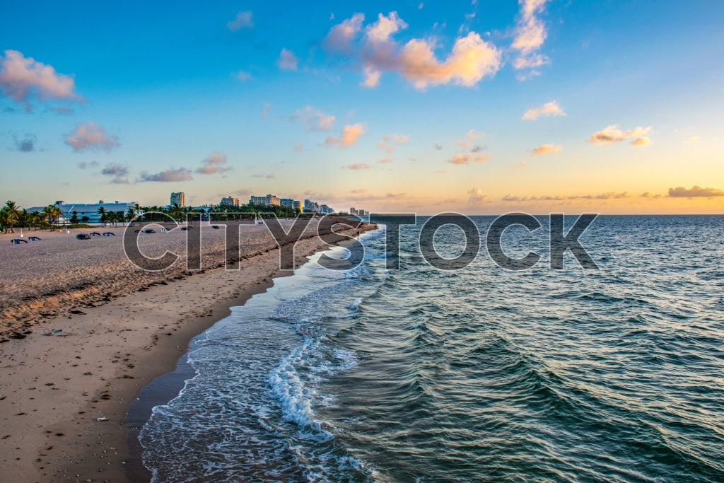 Early morning sunrise over Fort Lauderdale Beach with ocean waves