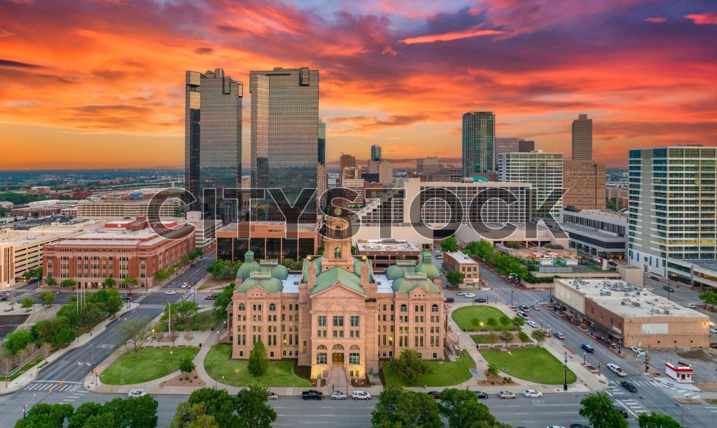 Aerial view of Fort Worth skyline at sunset with vibrant skies