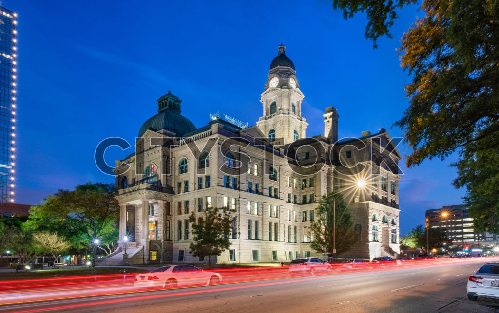 Historic Fort Worth Courthouse in Texas captured at twilight with colorful light trails