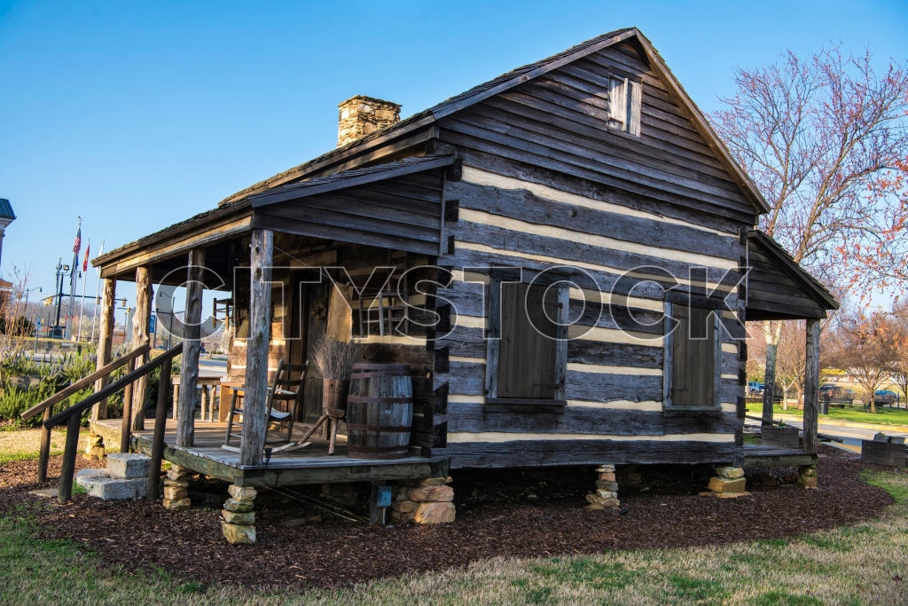 Historic wooden cabin with American flag in Gaffney, SC
