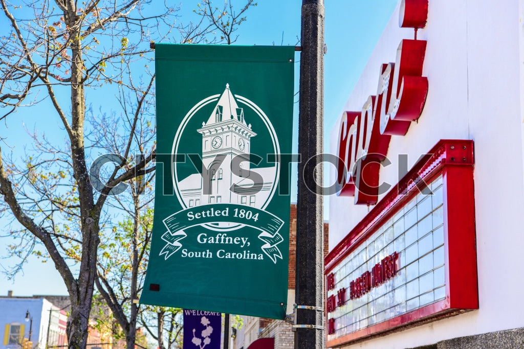 Historic Gaffney, SC banner against blue sky, with urban background