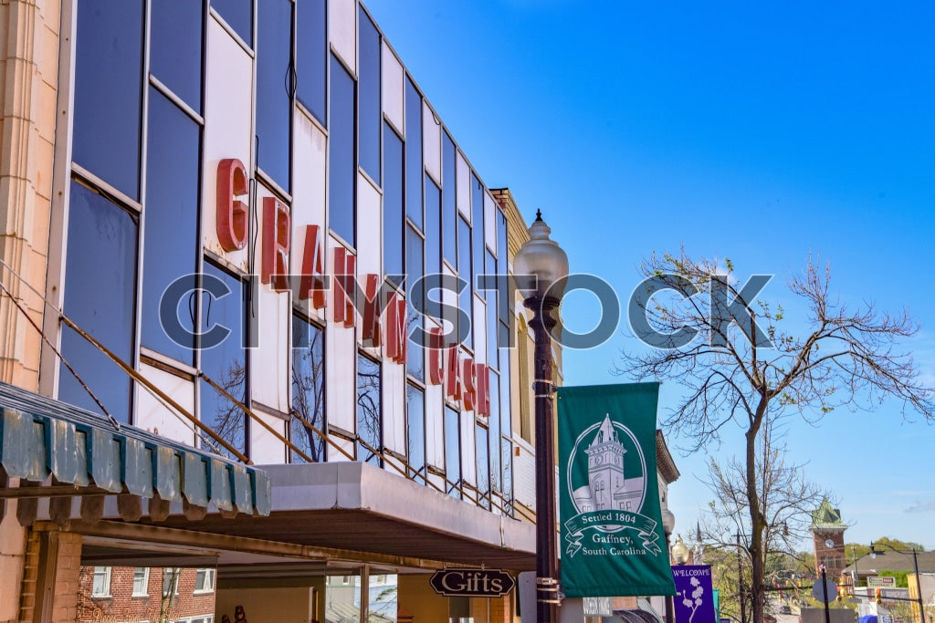 Old department store sign with civic banners in Gaffney, SC