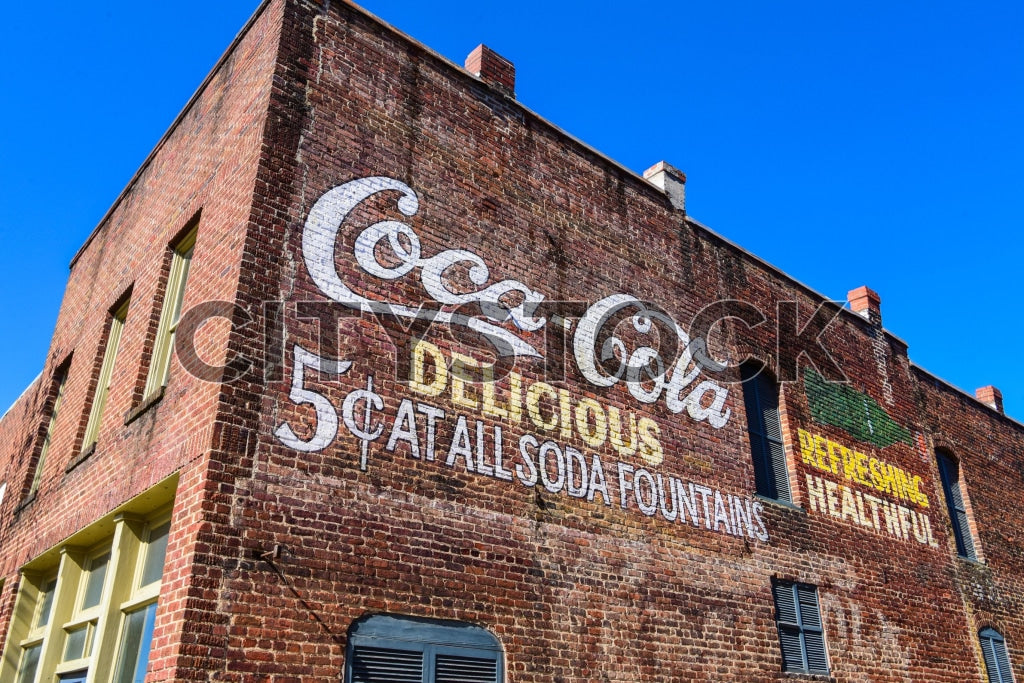 Vintage Coca-Cola advertisement on weathered brick wall in Gaffney