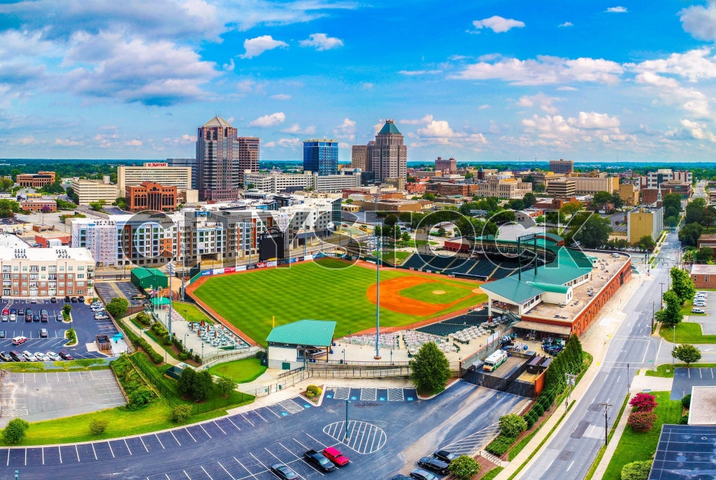Aerial view of downtown Greensboro, NC showing skyline and stadium