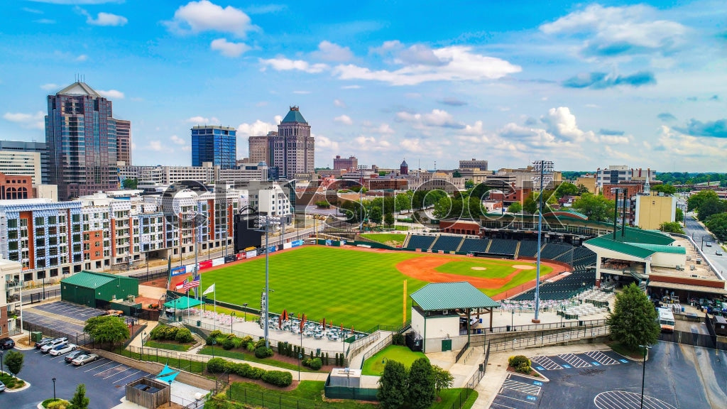 Aerial view of downtown Greensboro, NC showing cityscape and stadium