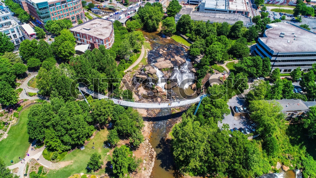 Aerial view of Greenville SC river, bridges, and lush parks