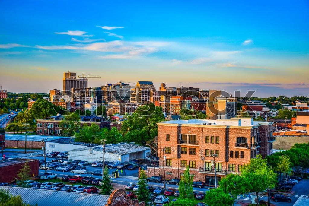 Aerial view of Greenville, SC skyline at sunset with blue skies