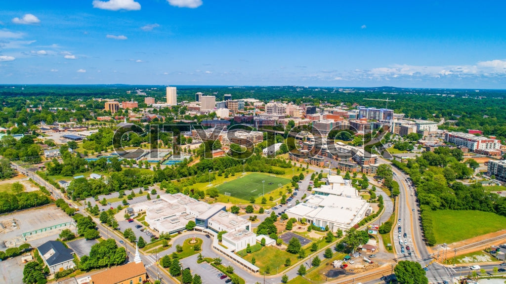 Aerial view of Greenville SC showcasing urban layout under blue sky