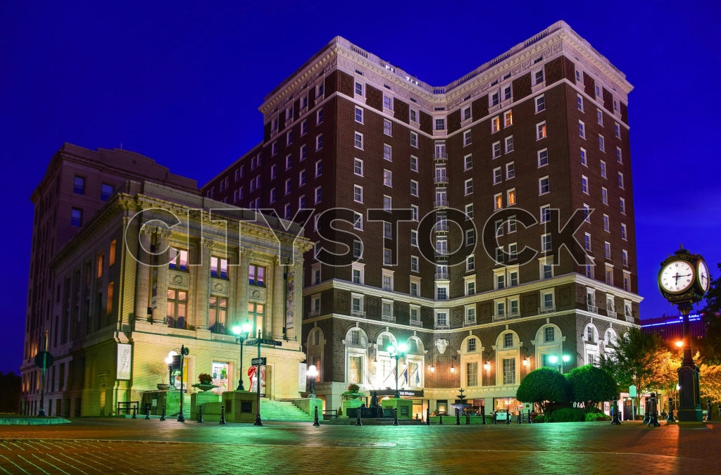 Historic buildings and clock tower in Greenville, SC at twilight