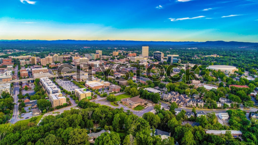 Aerial view of downtown Greenville, SC at sunset with blue skies