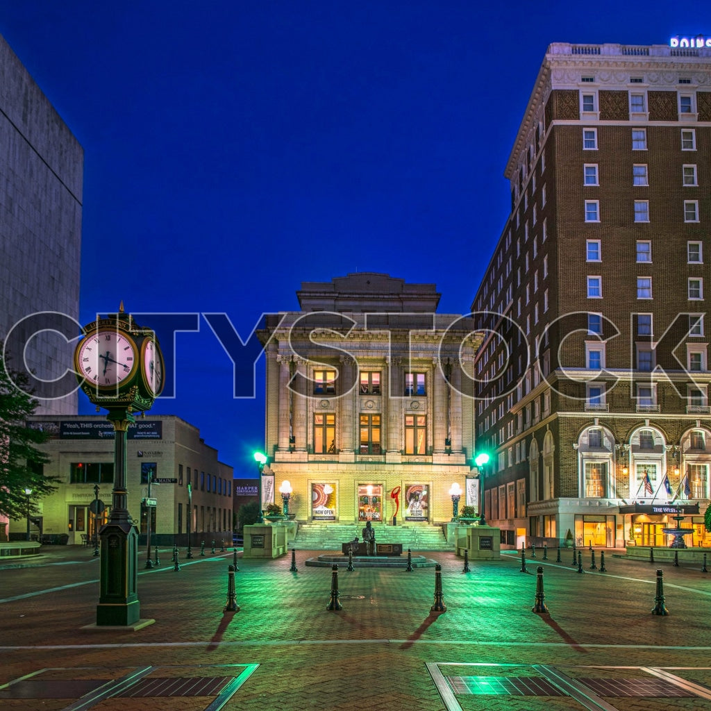 Vintage clock and historical buildings in Downtown Greenville, SC during twilight