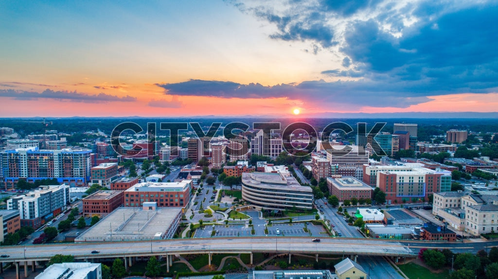 Aerial view of Greenville, SC cityscape at sunset