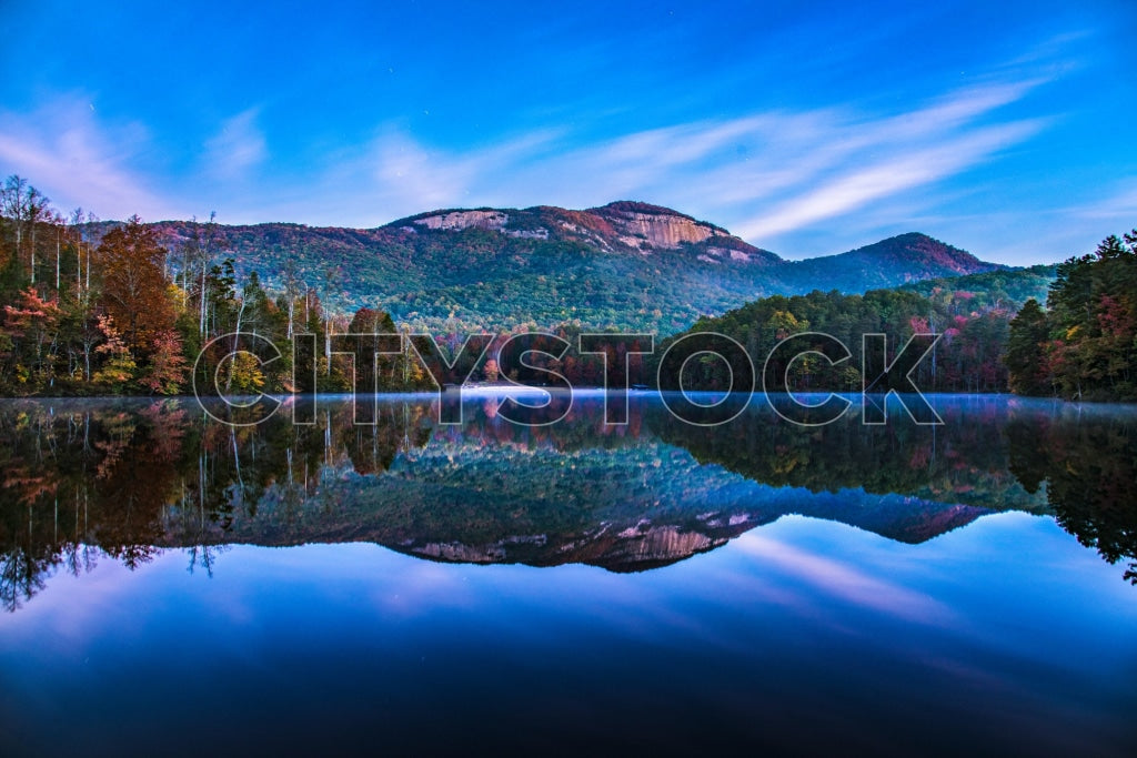 Sunrise with lake reflection of mountains in Greenville