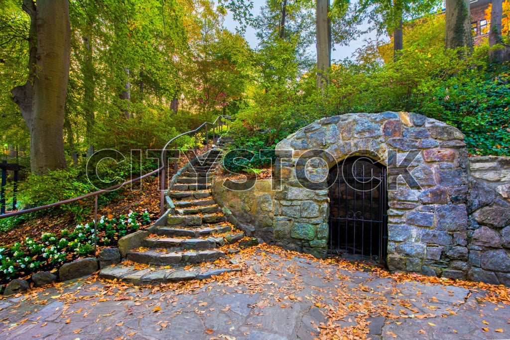Historic stone gate with autumn leaves in Greenville