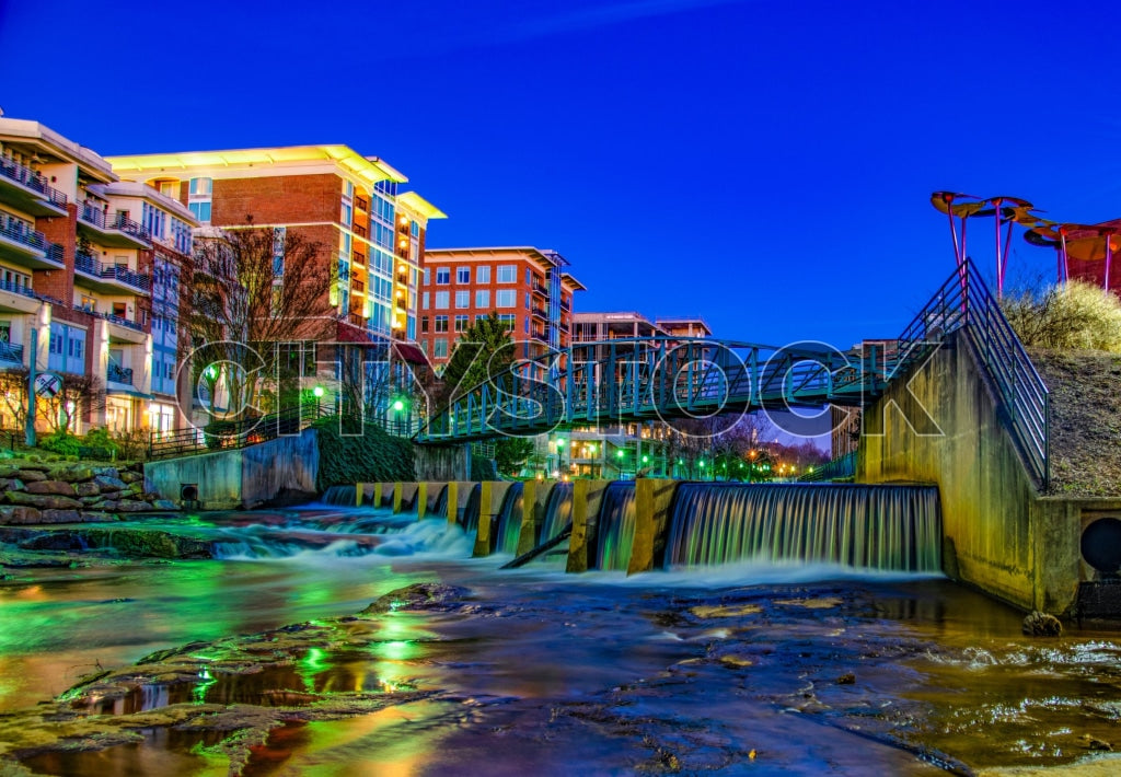Twilight urban scene with a glowing waterfall in Greenville, SC