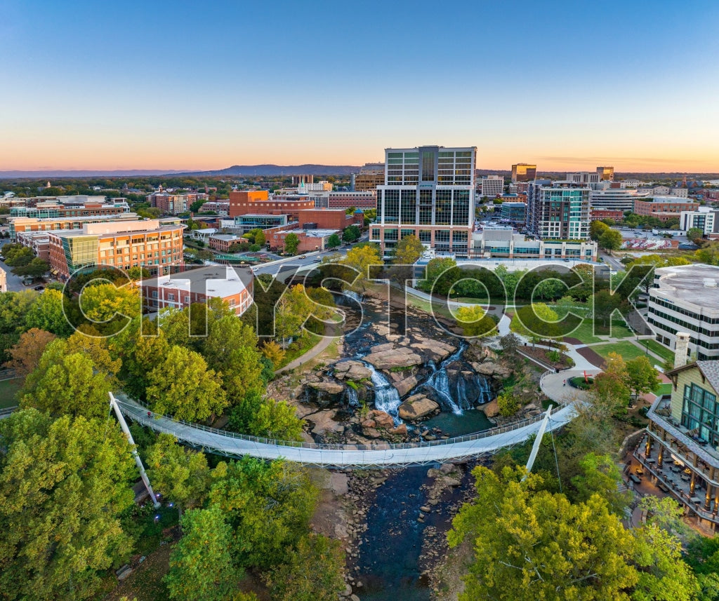 Aerial view of Greenville skyline at sunset with Reedy River