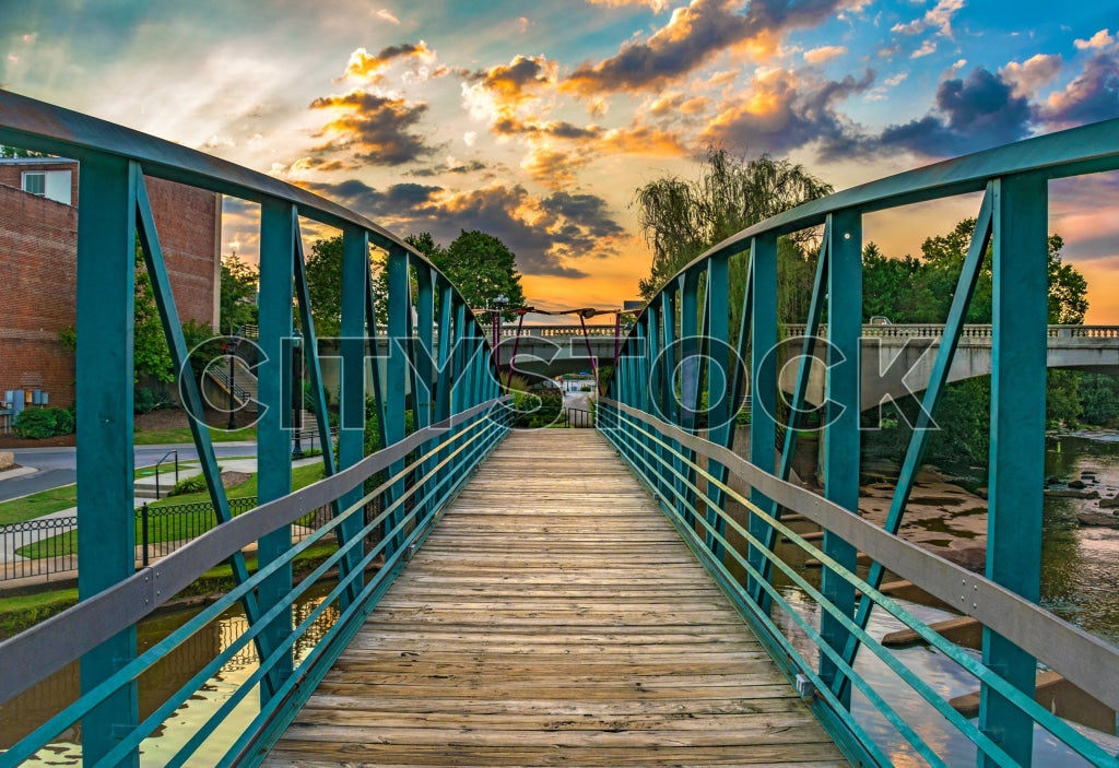 Sunset view over Greenville river bridge with vibrant sky
