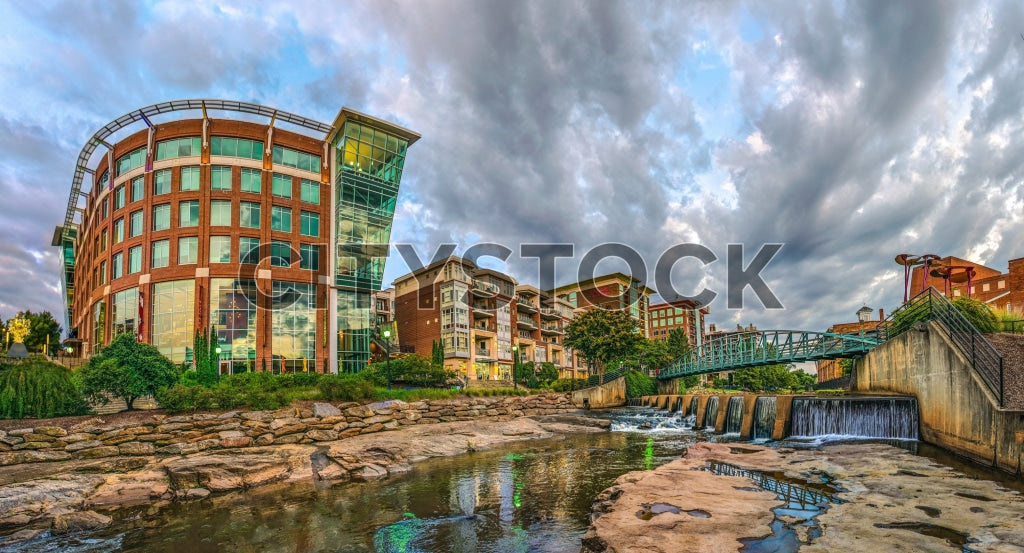 Greenville SC cityscape with modern buildings and river at sunset