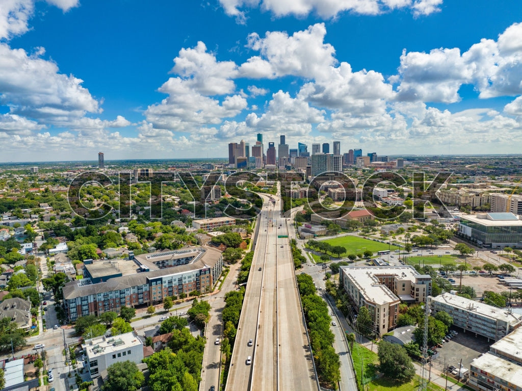 Aerial view of Houston skyline, highways and lush parklands