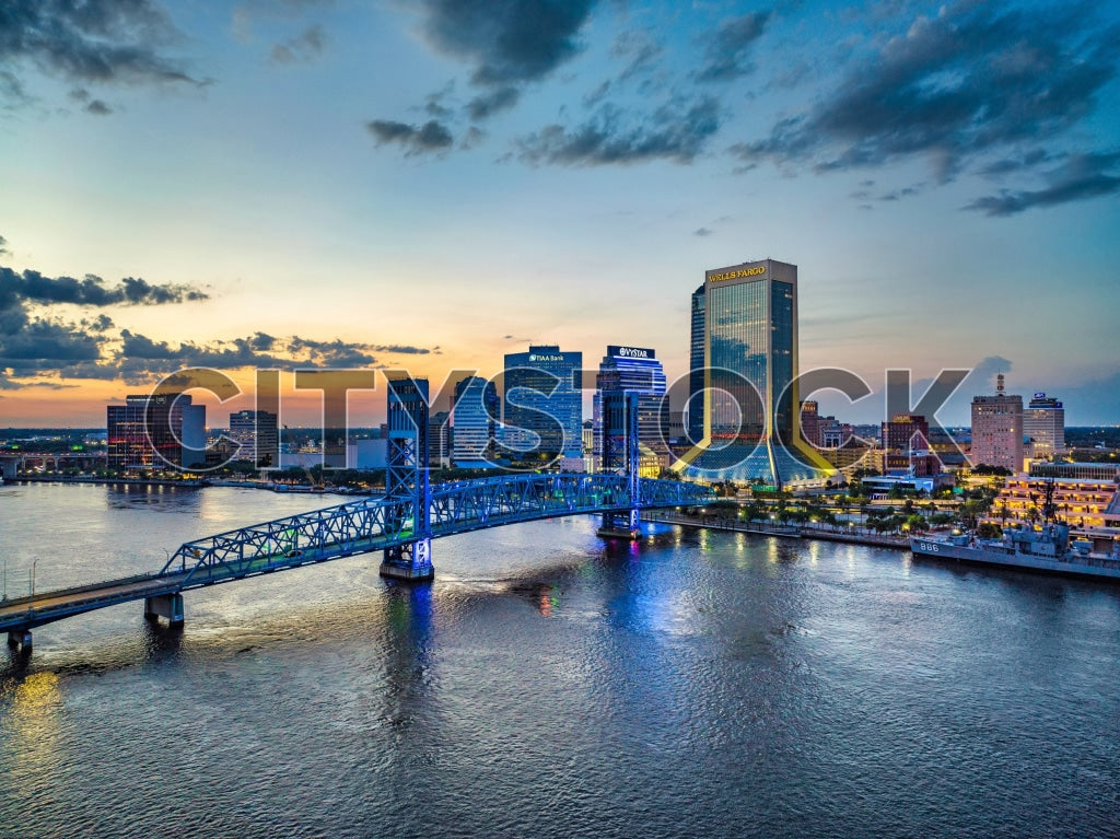 Aerial view of Jacksonville skyline during sunset with city buildings and river