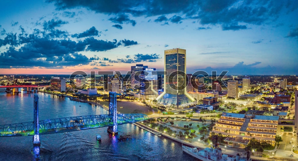 Aerial view of Jacksonville, FL skyline with bridges at sunset