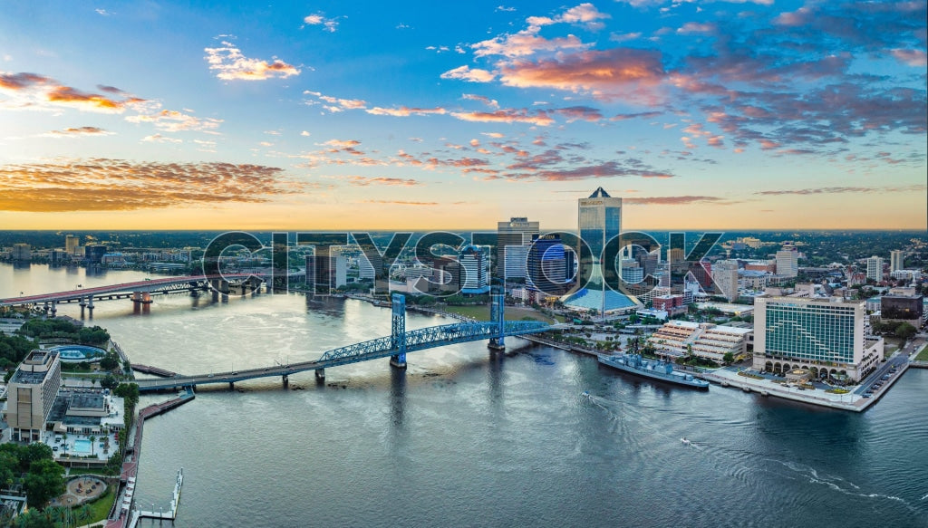 Aerial view of Jacksonville skyline and bridges at sunrise