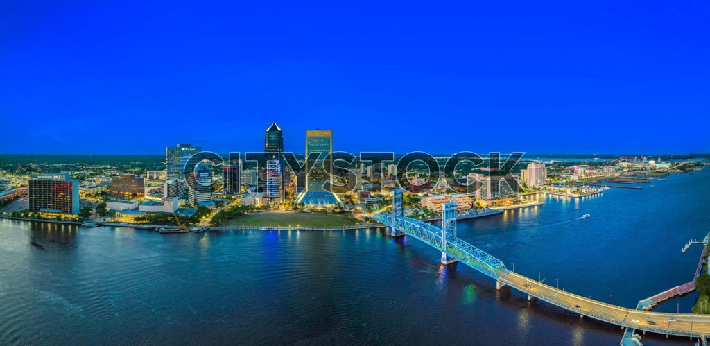 Aerial view of Jacksonville cityscape and bridges at sunset