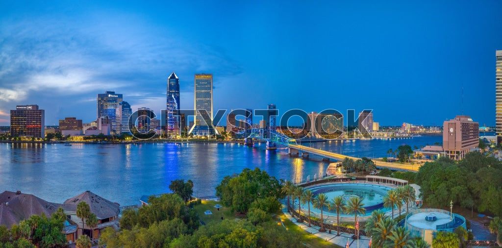 Panoramic view of Jacksonville skyline at twilight with river