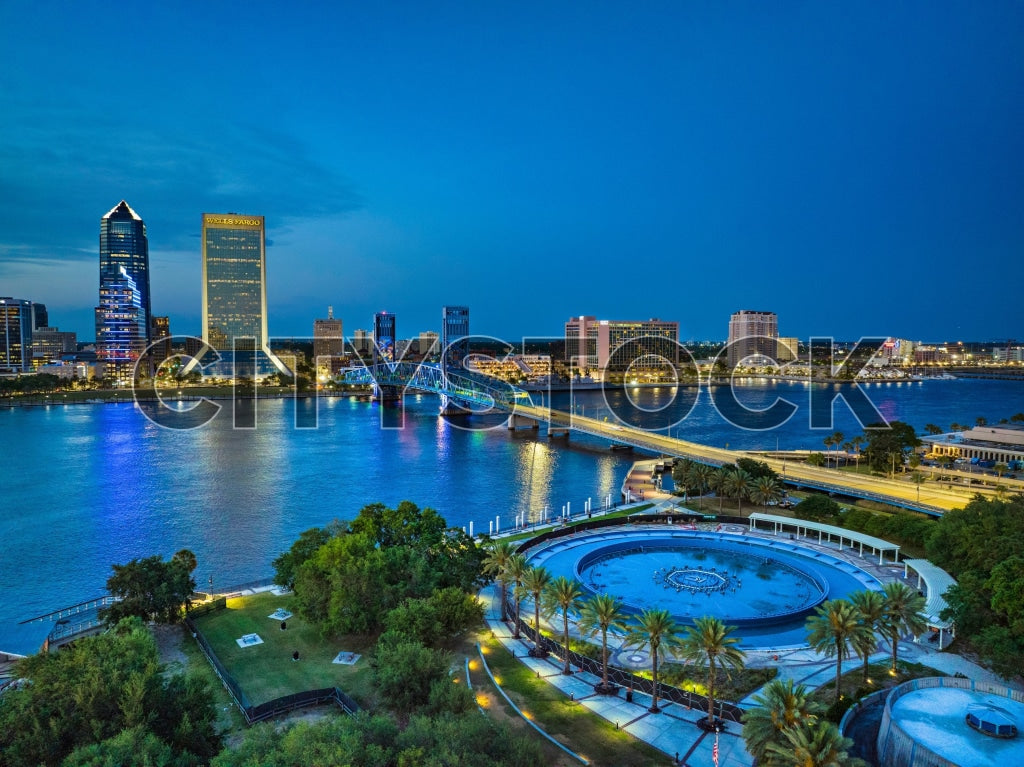 Jacksonville skyline at night with vibrant lighting and river reflections