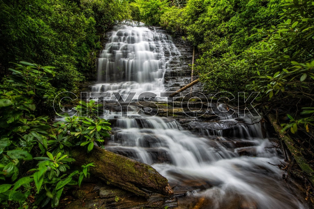 Long exposure of Kings Creek Falls amidst lush greenery in South Carolina