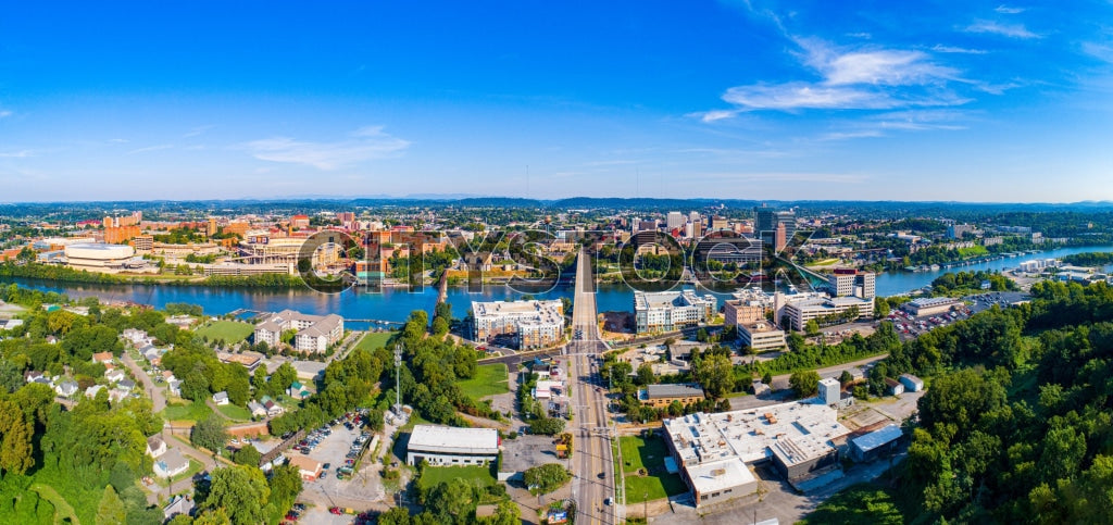 Aerial cityscape of Knoxville, TN with downtown buildings and river
