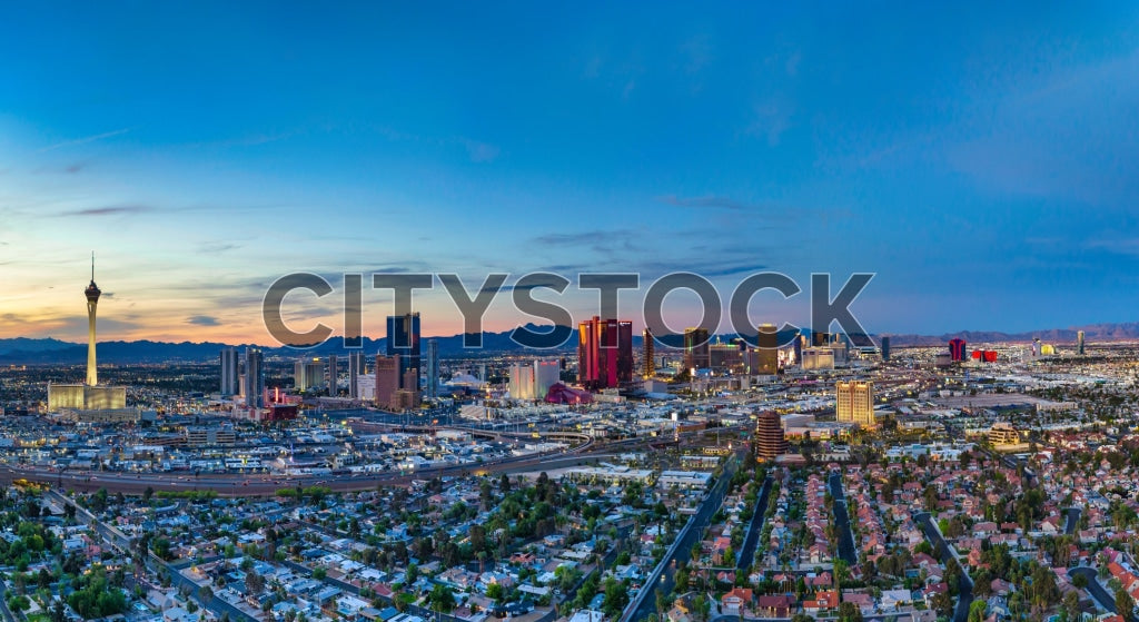 Aerial view of Las Vegas skyline at sunset with glowing city lights