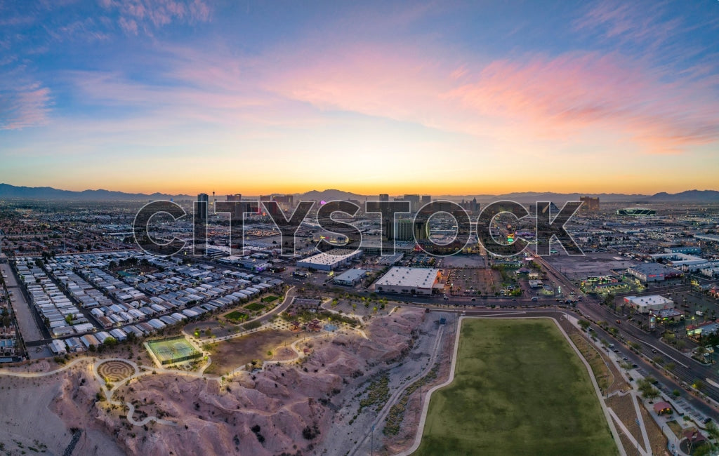 Aerial view of Las Vegas at sunrise featuring colorful sky