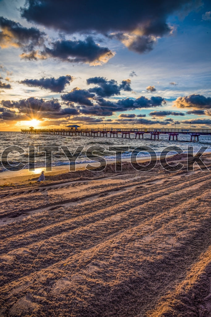 Golden sunset over wooden pier at Lauderdale by the Sea, Florida
