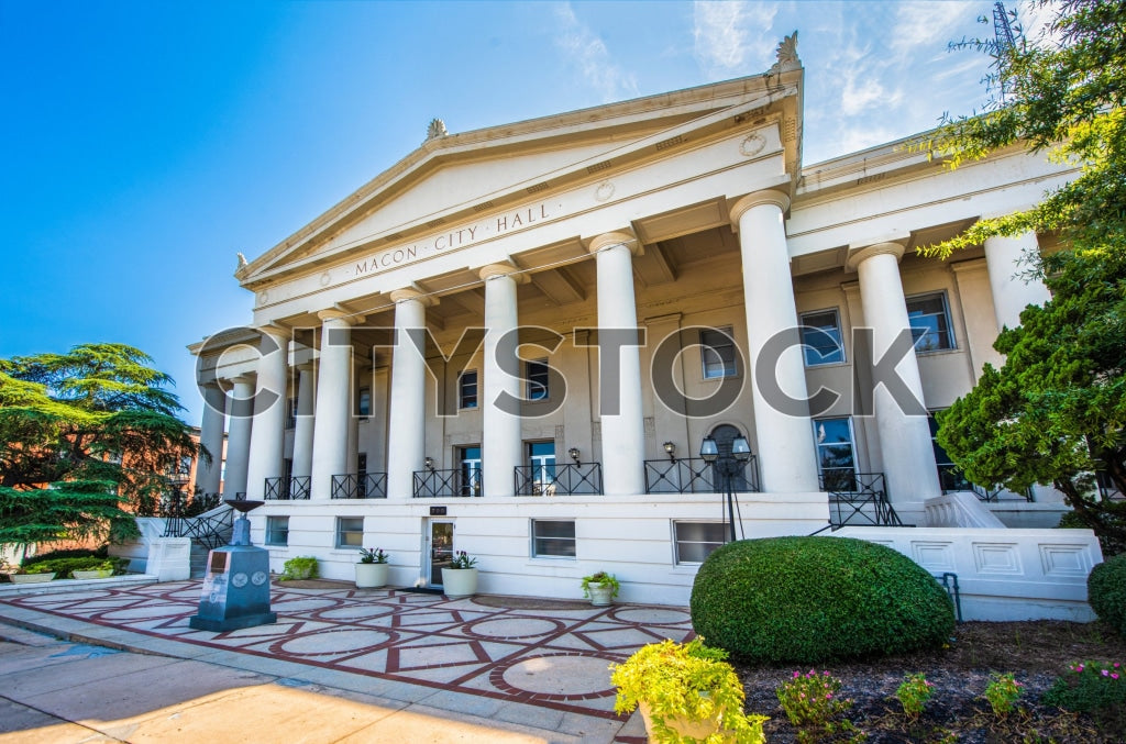 Macon City Hall with blue sky and lush greenery in Georgia